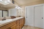 Queen guest suite 2 with sliding barn door, lower level, private patio with cafe table and chairs 
